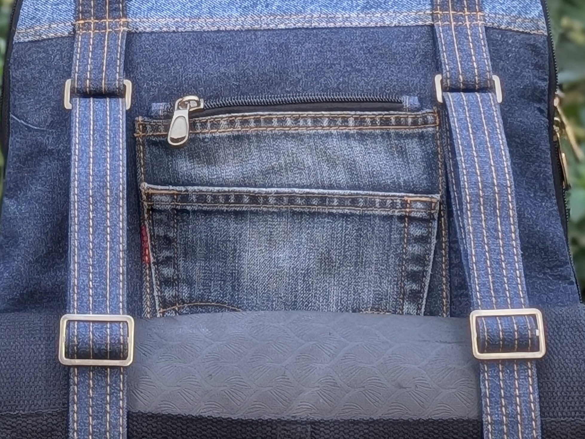 Close view of Born Again's exterior pockets and adjustable straps