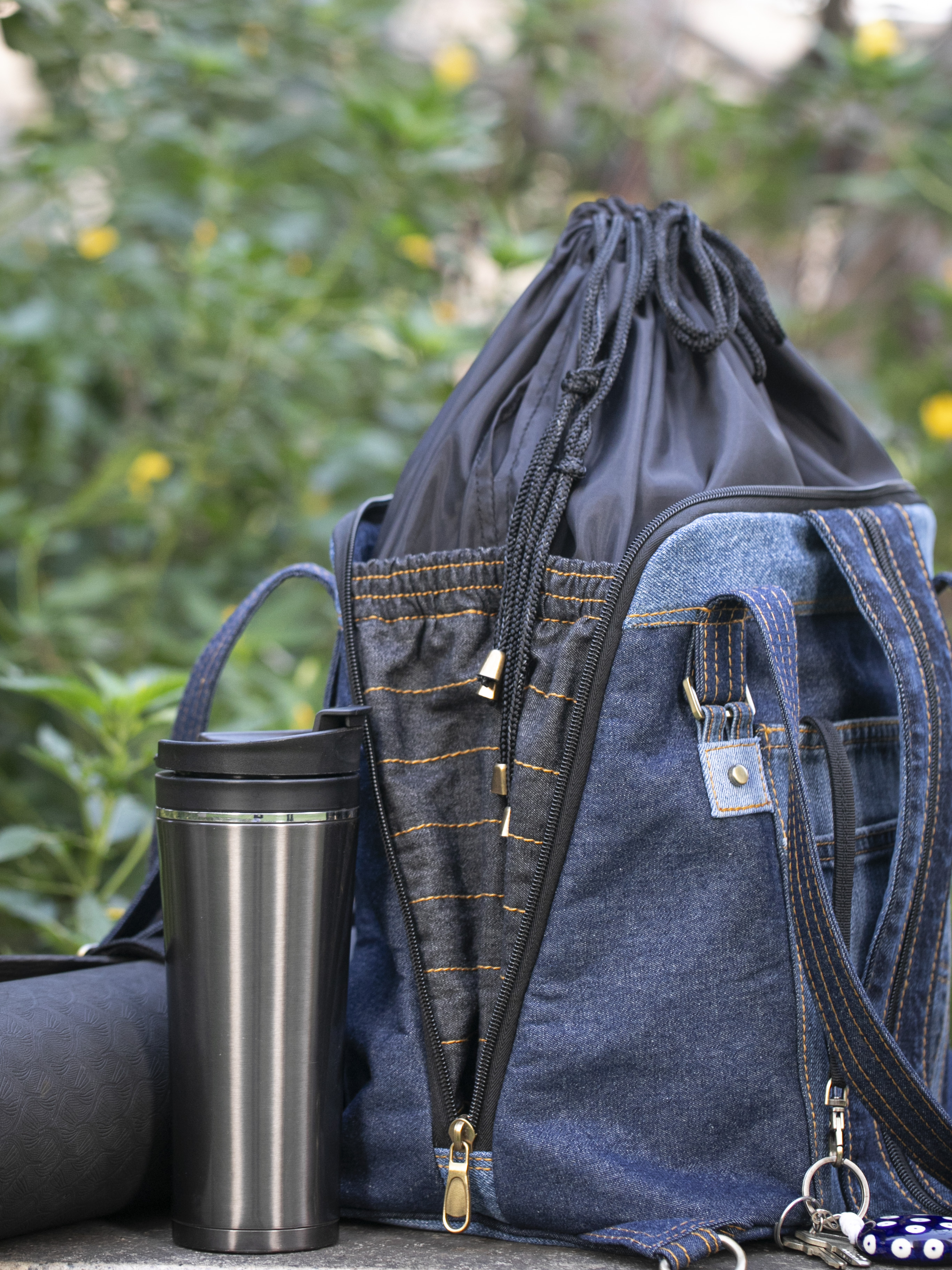 Open drawstring extension showing the Born Again bag's expandable capacity